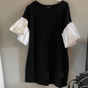 Chic Black and White Midi Dress with Ruffle Sleeves